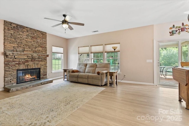 16018 Hollingbourne Rd, Huntersville, NC 28078 - living room featuring a ceiling fan, healthy amount of natural light, and light wood-style flooring