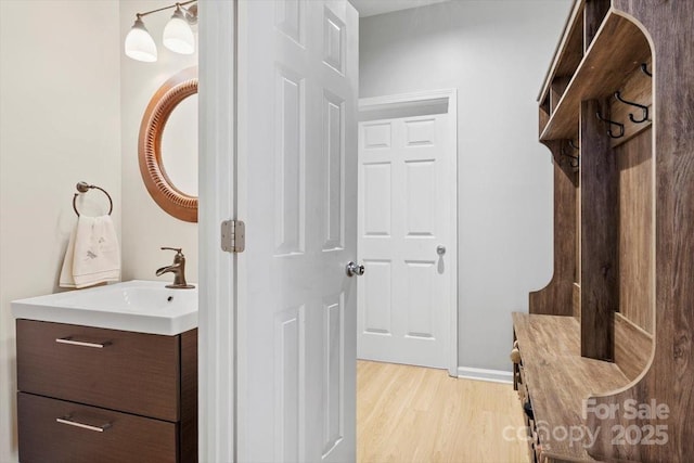 16018 Hollingbourne Rd, Huntersville, NC 28078 - bathroom featuring vanity and wood finished floors