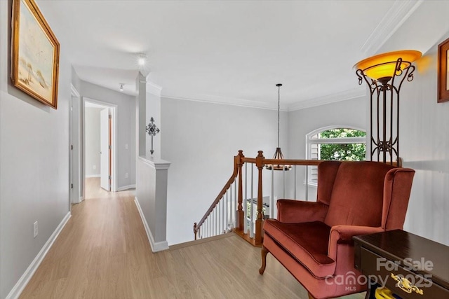 16018 Hollingbourne Rd, Huntersville, NC 28078 - hallway with an upstairs landing, light wood-style flooring, baseboards, and crown molding