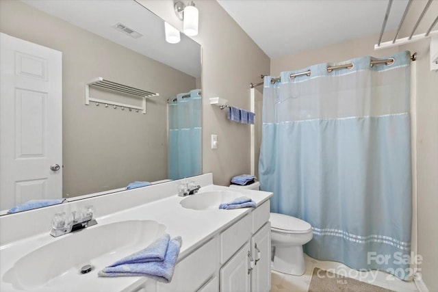 16018 Hollingbourne Rd, Huntersville, NC 28078 - full bath featuring toilet, double vanity, tile patterned floors, and curtained shower
