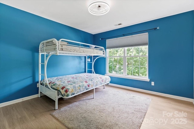 16018 Hollingbourne Rd, Huntersville, NC 28078 - bedroom with baseboards and wood finished floors