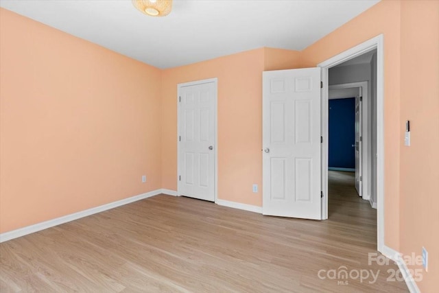 16018 Hollingbourne Rd, Huntersville, NC 28078 - unfurnished bedroom with light wood-style floors and baseboards