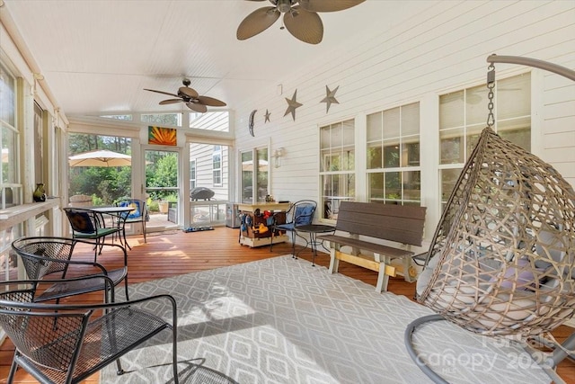 16018 Hollingbourne Rd, Huntersville, NC 28078 - sunroom / solarium featuring a ceiling fan, wood finished floors, a deck, wood walls, and vaulted ceiling