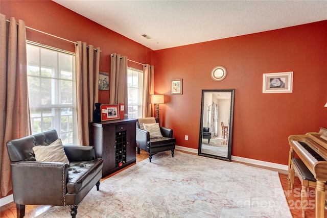 2024 Stonewyck Ave, Kannapolis, NC 28081 - living area with healthy amount of natural light, baseboards, and wood finished floors