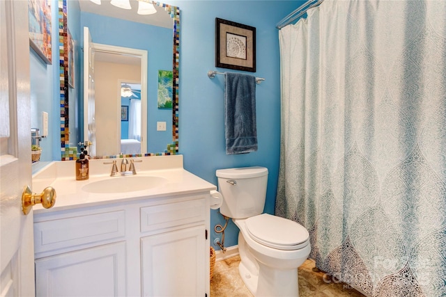 2024 Stonewyck Ave, Kannapolis, NC 28081 - ensuite bathroom with toilet, vanity, tile patterned floors, and a ceiling fan
