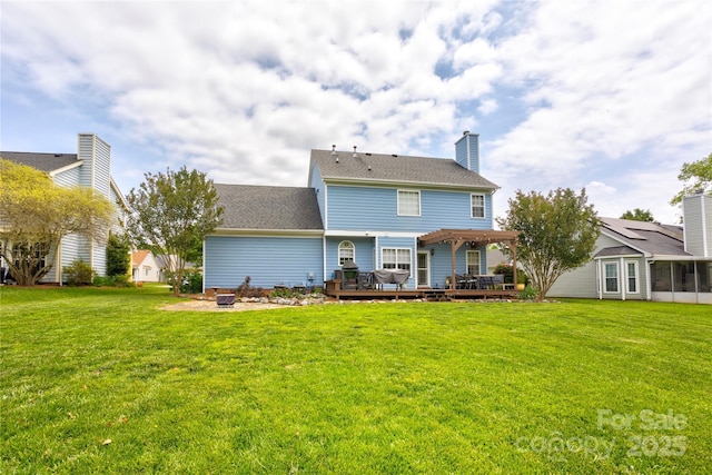 2024 Stonewyck Ave, Kannapolis, NC 28081 - back of property featuring a deck, a lawn, a pergola, and a sunroom