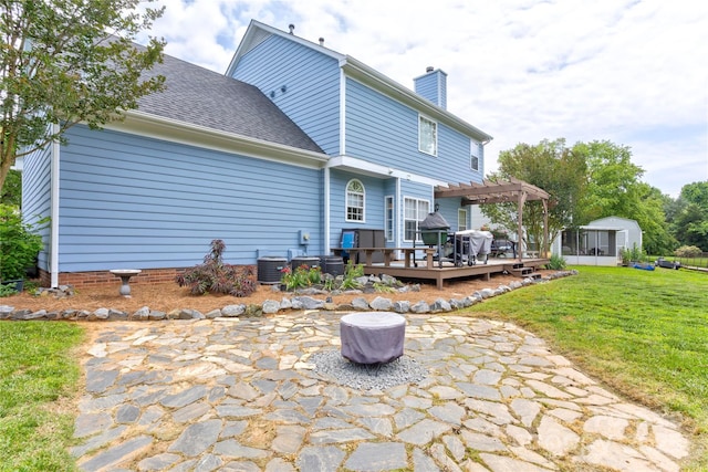 2024 Stonewyck Ave, Kannapolis, NC 28081 - rear view of house with a pergola, a deck, a yard, a chimney, and a patio area