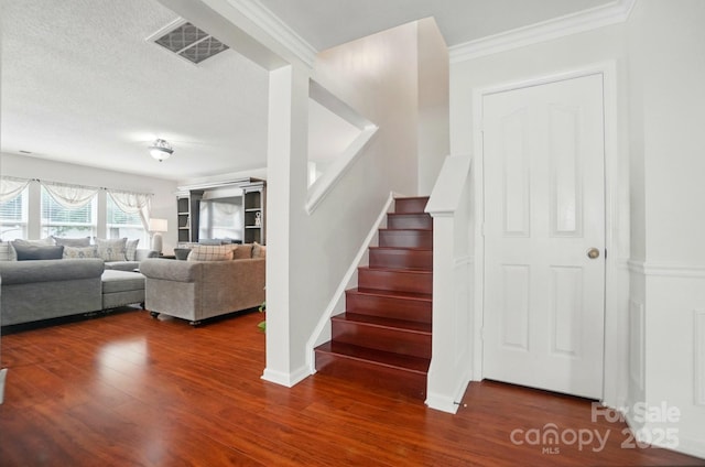 512 Nanny Point Dr, Monroe, NC 28110 - stairs with wood finished floors, ornamental molding, baseboards, and a textured ceiling