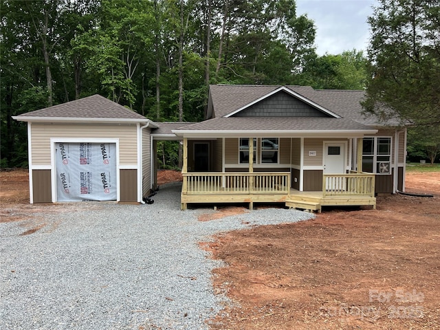 1987 Robert Rufty Ln, Catawba, NC 28609 - view of front of property with roof with shingles, an outbuilding, covered porch, and a garage