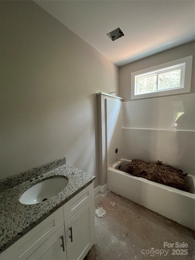 1987 Robert Rufty Ln, Catawba, NC 28609 - bathroom featuring vanity, baseboards, and tub / shower combination
