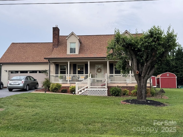 139 Pleasant Garden Dr, Taylorsville, NC 28681 - cape cod home featuring a porch, a chimney, a garage, a front lawn, and driveway