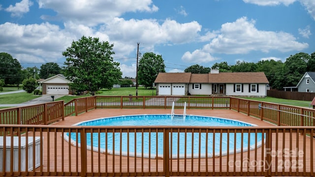 139 Pleasant Garden Dr, Taylorsville, NC 28681 - view of swimming pool with a deck and an outbuilding