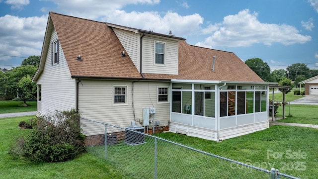 139 Pleasant Garden Dr, Taylorsville, NC 28681 - back of property featuring a sunroom, roof with shingles, and central air condition unit