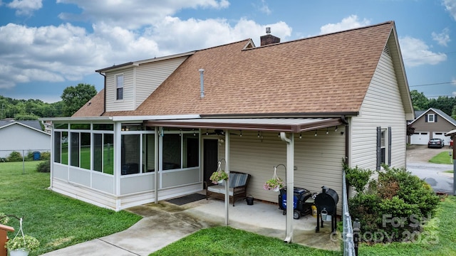 139 Pleasant Garden Dr, Taylorsville, NC 28681 - rear view of house with roof with shingles, a chimney, a yard, a patio, and a sunroom