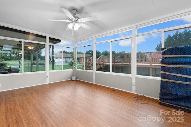 139 Pleasant Garden Dr, Taylorsville, NC 28681 - unfurnished sunroom with ceiling fan and wood finished floors