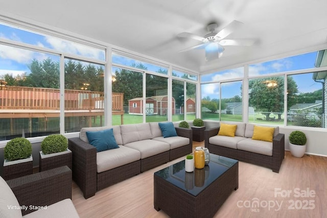 139 Pleasant Garden Dr, Taylorsville, NC 28681 - sunroom / solarium with outdoor lounge area, ceiling fan, wood finished floors, and a deck
