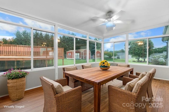 139 Pleasant Garden Dr, Taylorsville, NC 28681 - sunroom / solarium with ceiling fan, outdoor dining space, wood finished floors, and a wooden deck