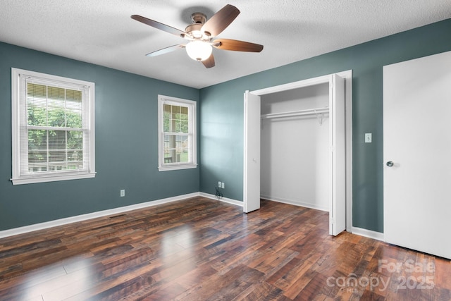 139 Pleasant Garden Dr, Taylorsville, NC 28681 - unfurnished bedroom featuring dark wood finished floors, a closet, a ceiling fan, baseboards, and a textured ceiling
