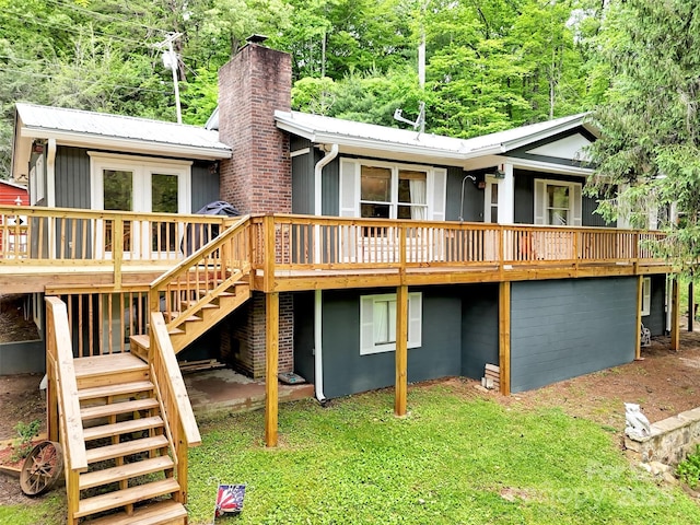 49 Trimont Mountain Trl, Franklin, NC 28734 - back of property featuring stairs, a wooden deck, a chimney, and metal roof