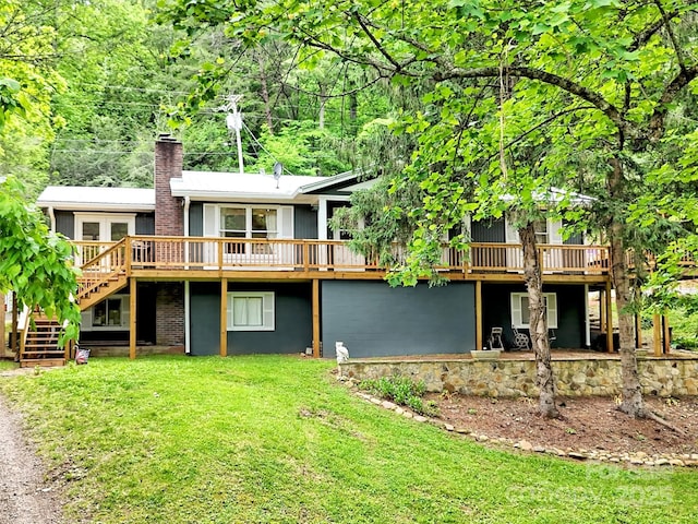 49 Trimont Mountain Trl, Franklin, NC 28734 - rear view of house featuring a wooden deck, a lawn, a chimney, and stairs