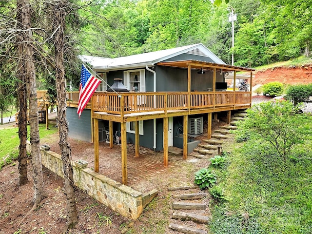 49 Trimont Mountain Trl, Franklin, NC 28734 - view of front of home featuring a wooden deck, central air condition unit, and a forest view