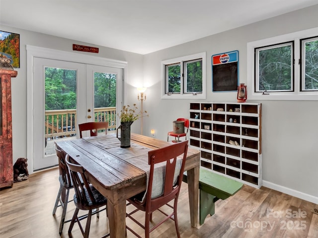 49 Trimont Mountain Trl, Franklin, NC 28734 - dining room with wood finished floors, french doors, and baseboards