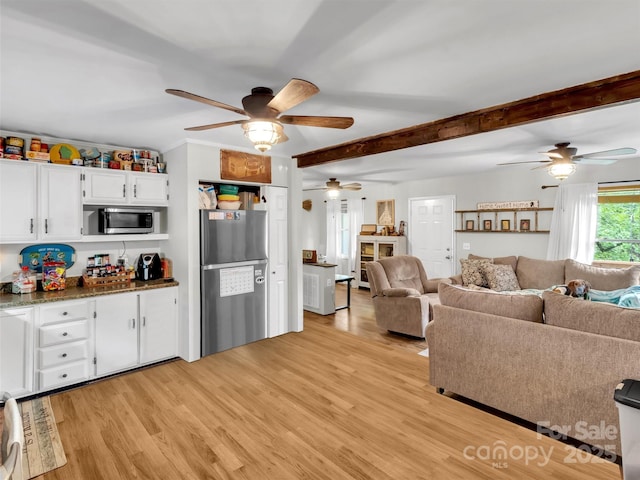 49 Trimont Mountain Trl, Franklin, NC 28734 - living room featuring a ceiling fan, light wood-type flooring, and beamed ceiling