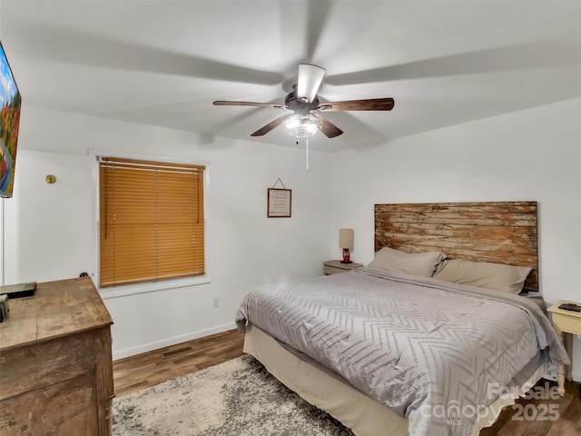 49 Trimont Mountain Trl, Franklin, NC 28734 - bedroom featuring wood finished floors, baseboards, and ceiling fan