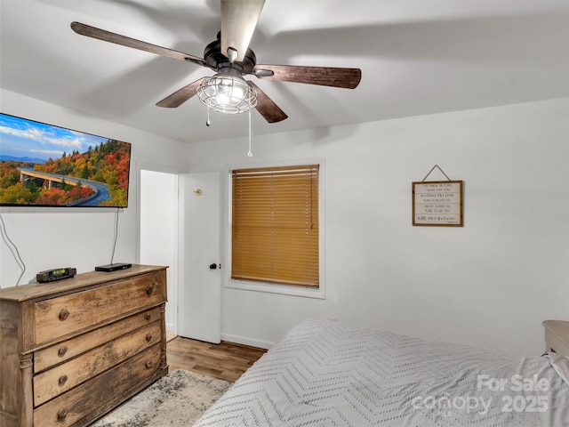 49 Trimont Mountain Trl, Franklin, NC 28734 - bedroom with light wood-style floors and a ceiling fan