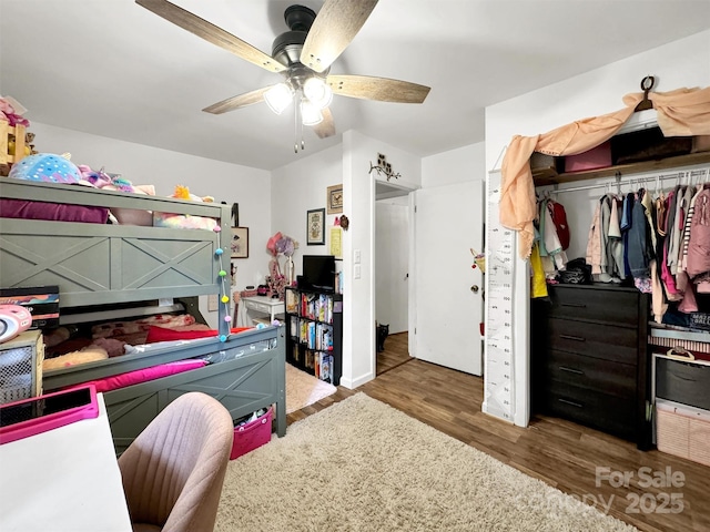 49 Trimont Mountain Trl, Franklin, NC 28734 - bedroom with wood finished floors, a closet, and ceiling fan