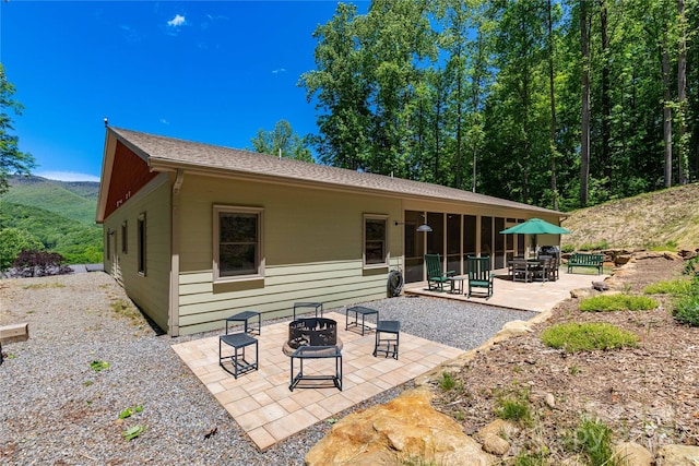 33 Freedom Dr, Waynesville, NC 28786 - back of property featuring a patio and roof with shingles