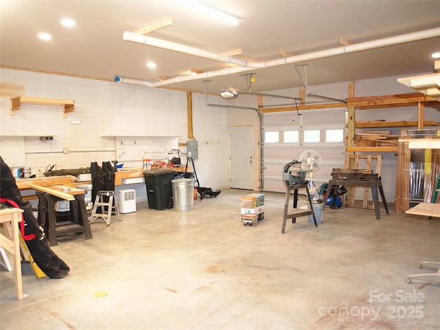 33 Freedom Dr, Waynesville, NC 28786 - garage featuring a workshop area, a garage door opener, and electric panel