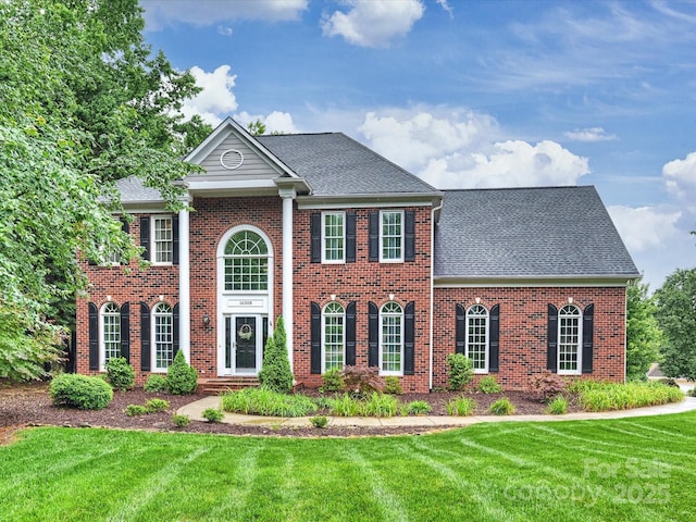 16308 Woolwine Rd, Charlotte, NC 28278 - view of front of property featuring brick siding, a front yard, and roof with shingles