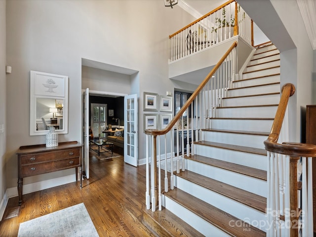 16308 Woolwine Rd, Charlotte, NC 28278 - foyer featuring french doors, a towering ceiling, wood finished floors, and stairway