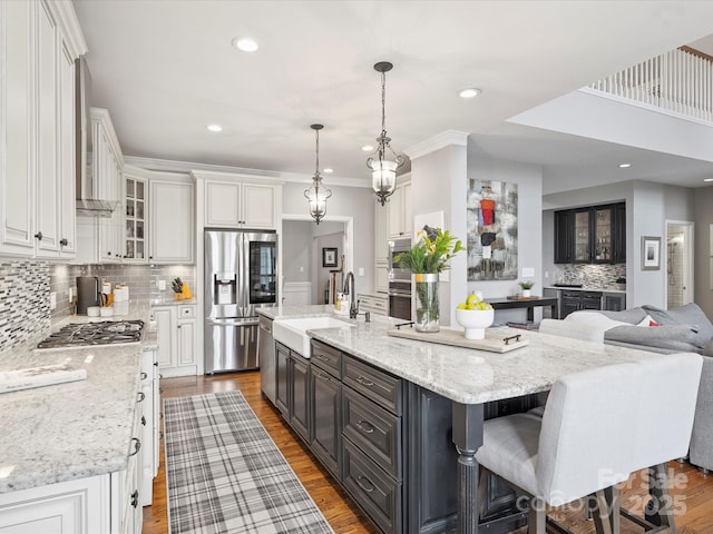 16308 Woolwine Rd, Charlotte, NC 28278 - kitchen with stainless steel appliances, white cabinets, tasteful backsplash, a sink, and recessed lighting