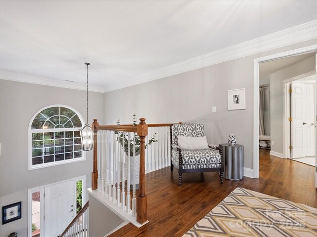 16308 Woolwine Rd, Charlotte, NC 28278 - hallway featuring a chandelier, wood finished floors, ornamental molding, baseboards, and an upstairs landing