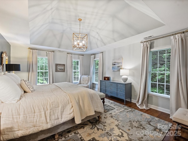 16308 Woolwine Rd, Charlotte, NC 28278 - bedroom with a chandelier, wood finished floors, and baseboards