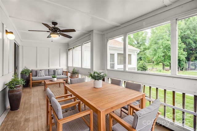 753 SW Dr, Davidson, NC 28036 - sunroom / solarium with ceiling fan, a decorative wall, wood-type flooring, and an outdoor hangout area