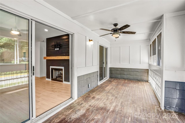 753 SW Dr, Davidson, NC 28036 - unfurnished sunroom with ceiling fan and a fireplace