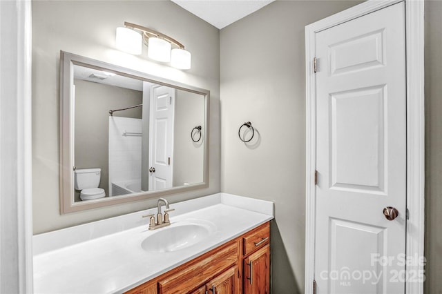 753 SW Dr, Davidson, NC 28036 - bathroom featuring vanity, toilet, and washtub / shower combination