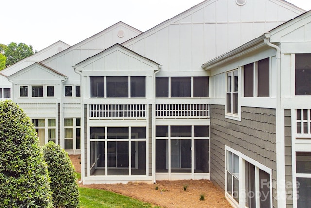 753 SW Dr, Davidson, NC 28036 - rear view of property with board and batten siding