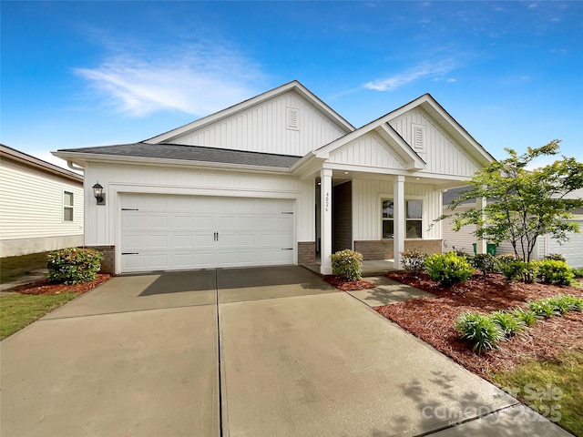 4026 Honey Locust Dr, Charlotte, NC 28215 - view of front of property with covered porch, driveway, board and batten siding, an attached garage, and roof with shingles