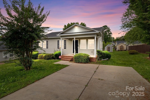 252 Sweet Bay Ln NW, Concord, NC 28027 - view of front facade featuring a porch and a lawn