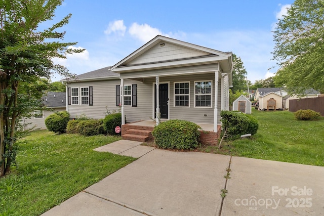 252 Sweet Bay Ln NW, Concord, NC 28027 - view of front facade featuring a front lawn and a porch