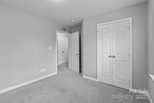 252 Sweet Bay Ln NW, Concord, NC 28027 - unfurnished bedroom featuring carpet floors, baseboards, and a closet