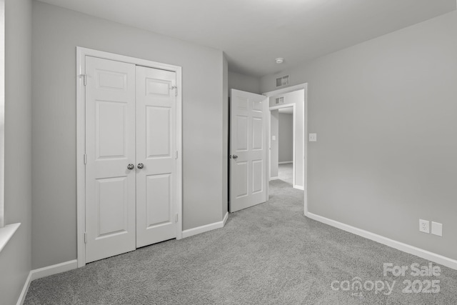 252 Sweet Bay Ln NW, Concord, NC 28027 - unfurnished bedroom featuring carpet flooring, baseboards, and a closet