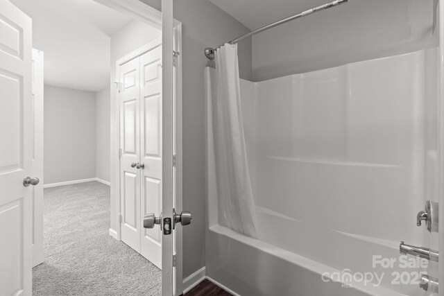 252 Sweet Bay Ln NW, Concord, NC 28027 - bathroom with shower / bath combination with curtain and baseboards