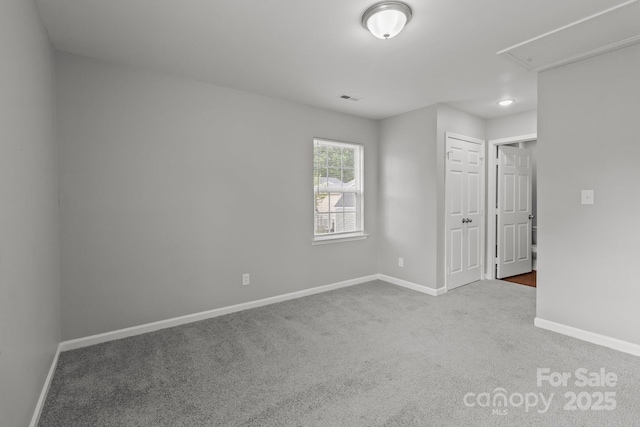 252 Sweet Bay Ln NW, Concord, NC 28027 - carpeted spare room with attic access and baseboards