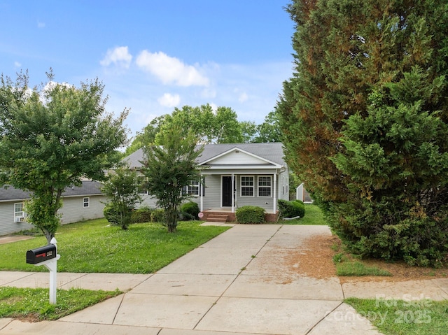 252 Sweet Bay Ln NW, Concord, NC 28027 - view of front of property with concrete driveway, a porch, and a front yard