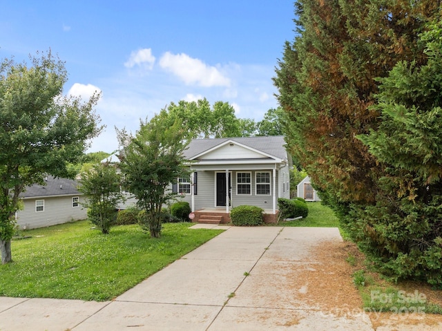 252 Sweet Bay Ln NW, Concord, NC 28027 - view of front of house featuring a porch and a front yard
